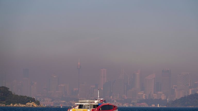 A passenger ferry leaves a wharf at Watsons Bay as...