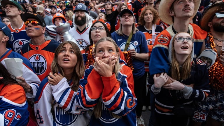 Edmonton Oilers fans react in Edmonton, Alberta, after the team's...