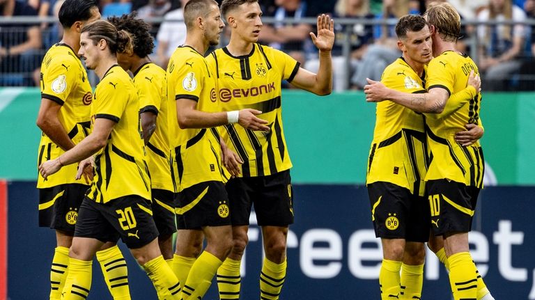 Dortmund's players celebrate during the German Cup soccer match between...