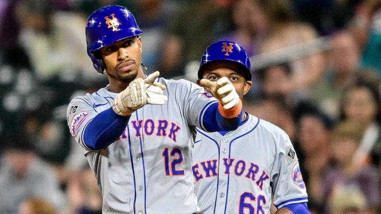 Francisco Lindor of the Mets celebrates after his ninth-inning two-run...