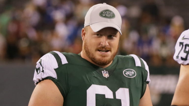 Jets center Spencer Long meets with members of the Giants...