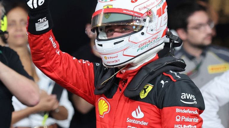 Ferrari driver Charles Leclerc of Monaco waves after qualifying session...