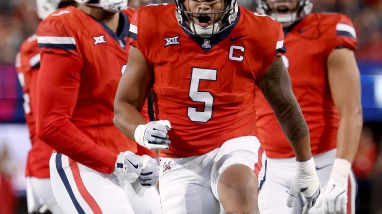 Arizona linebacker Jacob Manu (5) reacts after a play against...