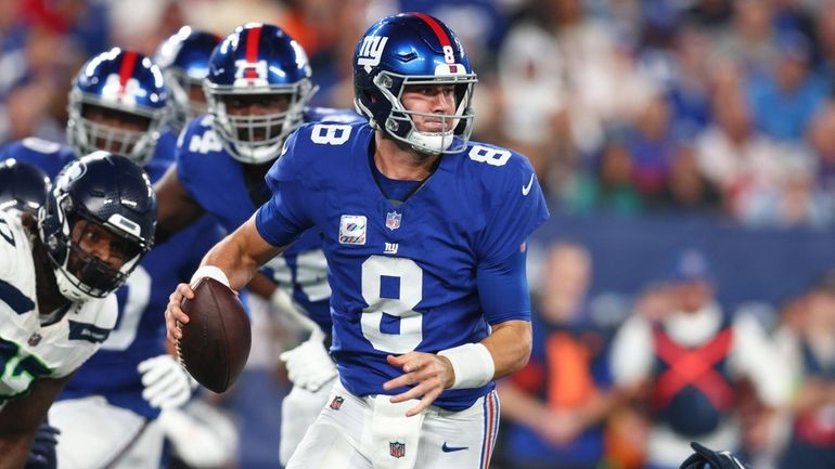 Daniel Jones #8 of the New York Giants looks to...