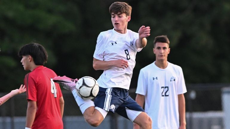 Connor Faello of Plainview-Old Bethpage JFK takes the ball on...