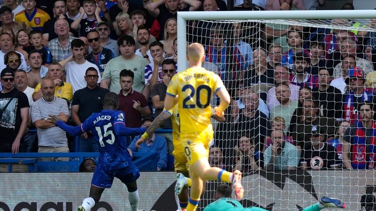 Chelsea's Nicolas Jackson, left, scores the opening goal during the...