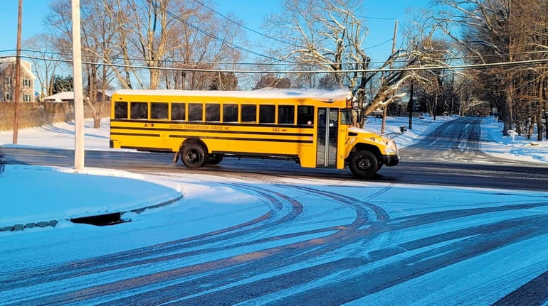 School bus makes its way along Mill Road in Yaphank...
