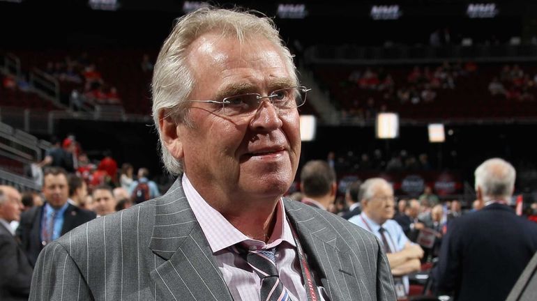 Glen Sather of the Rangers looks on from the draft floor...