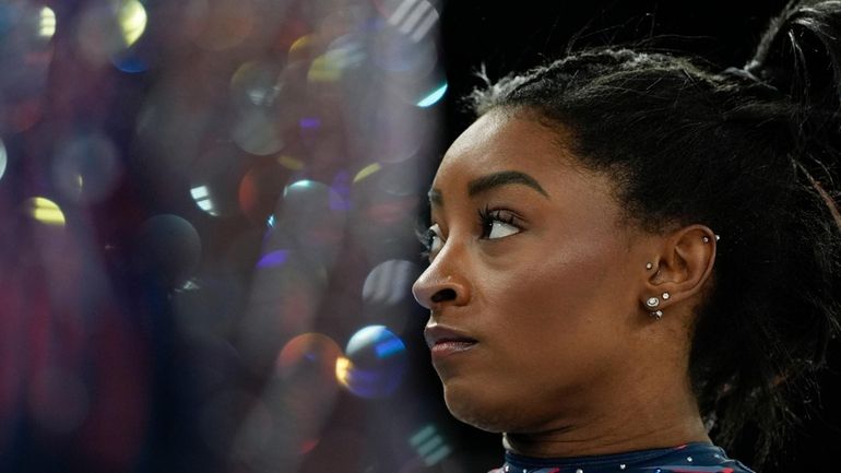 Simone Biles of the United States prepares to practice during...