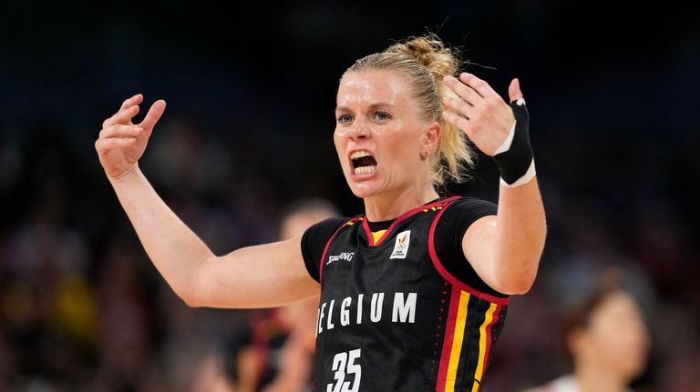 Julie Vanloo (35), of Belgium, celebrates after a three-point basket...