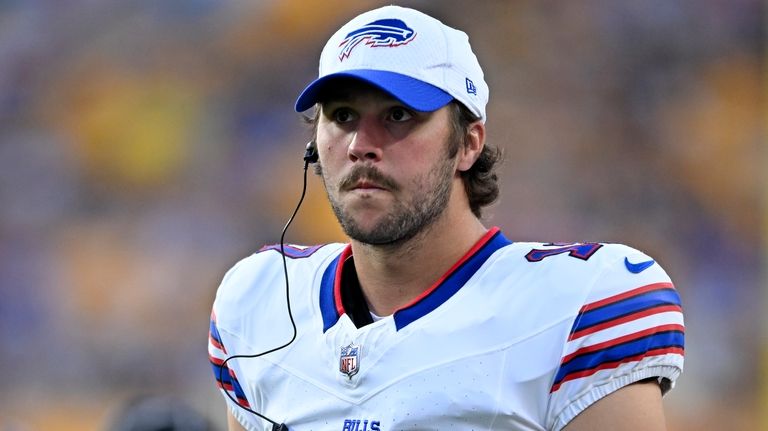 Buffalo Bills quarterback Josh Allen stands on the sidelines during...