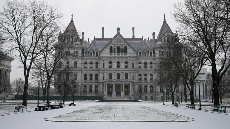 Snow covers the exterior of the New York state Capitol...