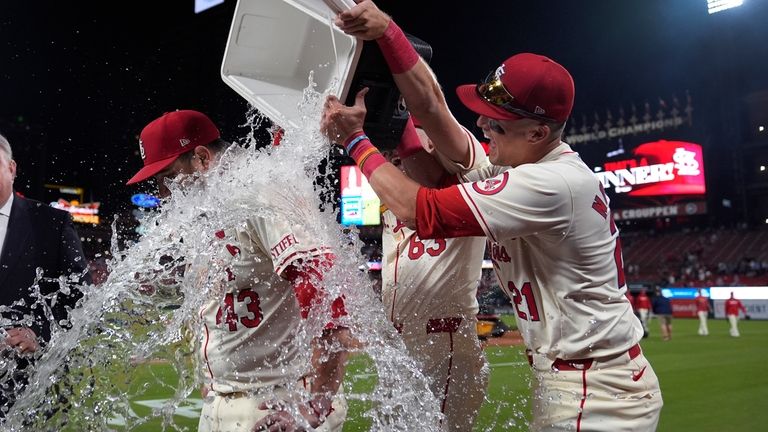 St. Louis Cardinals' Pedro Pages (43) is congratulated by teammates...