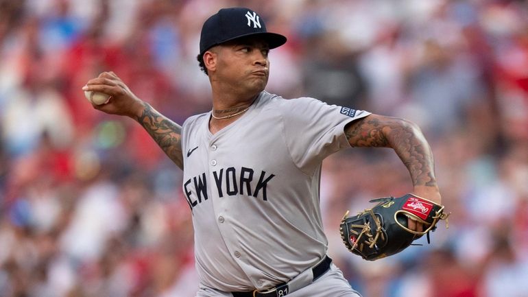 New York Yankees starting pitcher Luis Gil delivers during the...