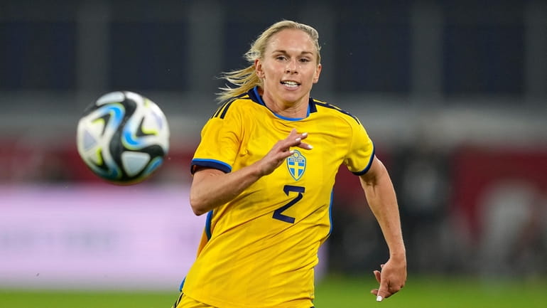Sweden's Jonna Andersson runs for the ball during the women's...