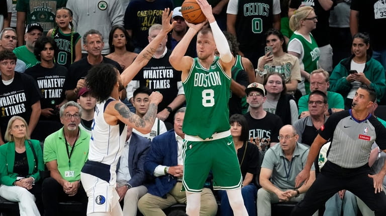 Boston Celtics center Kristaps Porzingis (8) looks to shoot at...