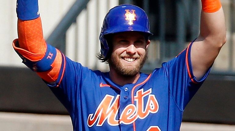 Jeff McNeil of the Mets reacts after a base hit during an...