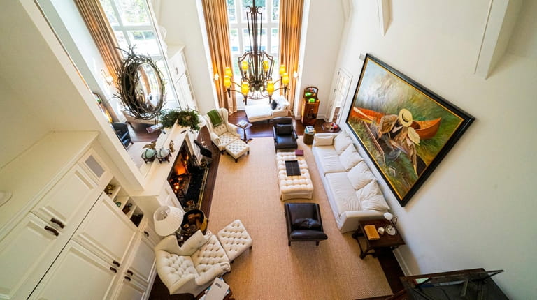 The East Hampton home's great room, seen from an upstairs balcony,...