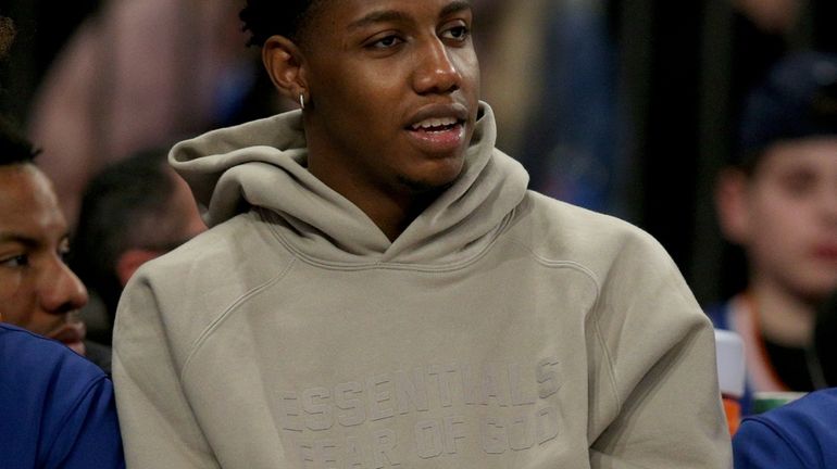 New York Knicks injured guard RJ Barrett (9) watches from...