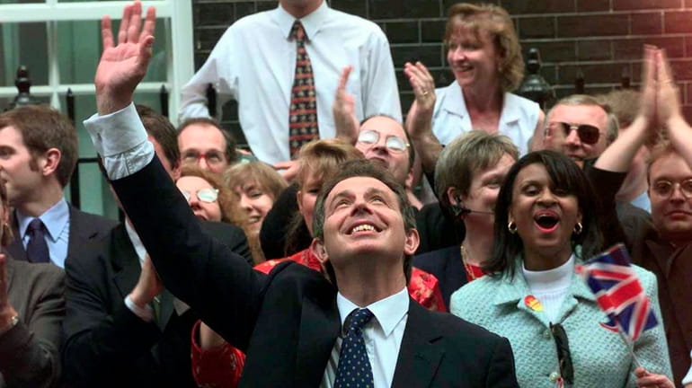 Britain's new Prime Minister Tony Blair, waves to well wishers...