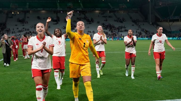 Canada team celebrates their side's 2-1 win at the end...