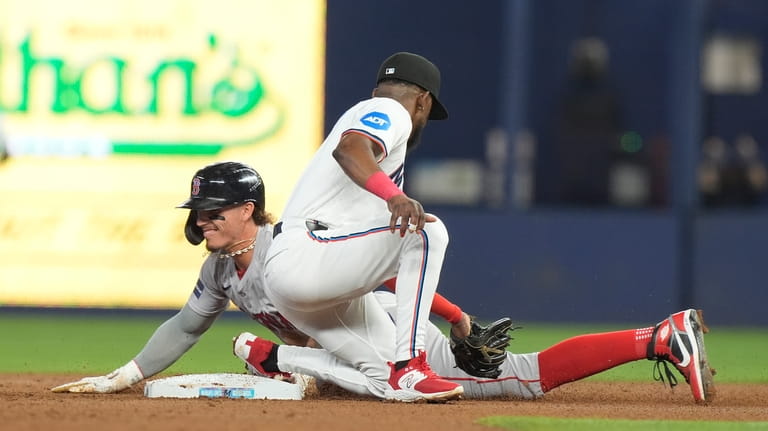 Boston Red Sox's Jarren Duran steals second base as Miami...