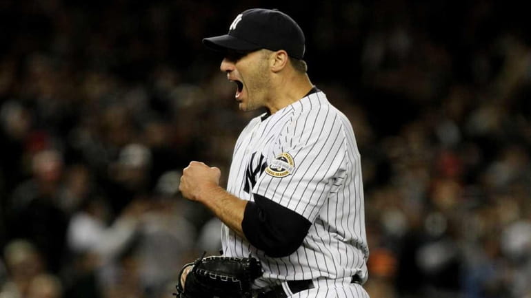 Andy Pettitte celebrates the end of the top of the...