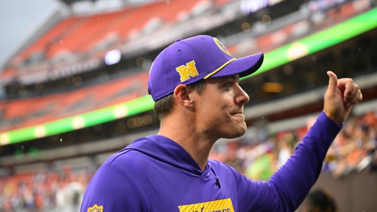 Minnesota Vikings head coach Kevin O'Connell walks off the field...