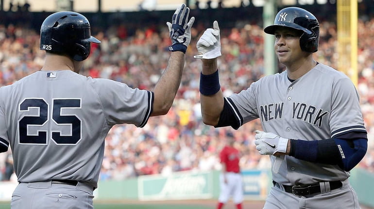 Photo: New York Yankees Derek Jeter bumps arms with with Johnny