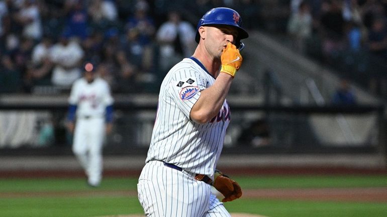 New York Mets first baseman Pete Alonso blows a kiss...