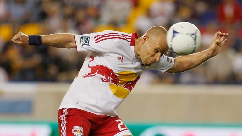 Joel Lindpere of the New York Red Bulls heads the...