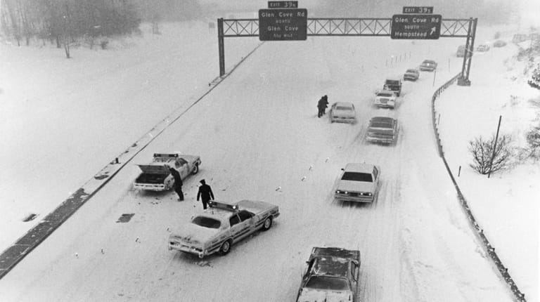 Nassau County police officers close the Long Island Expressway eastbound at...