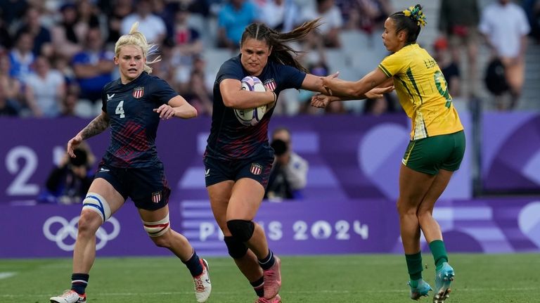 United States' Ilona Maher, enter gets past the tackle of...