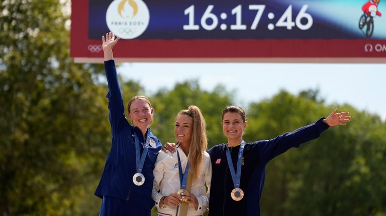 Pauline Ferrand Prevot, of France, centre, winner of the women's...