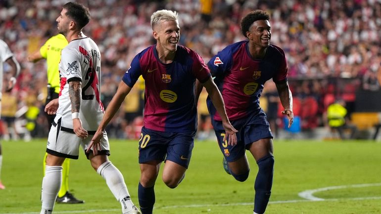 Barcelona's Dani Olmo, centre, celebrates after scoring his side's second...