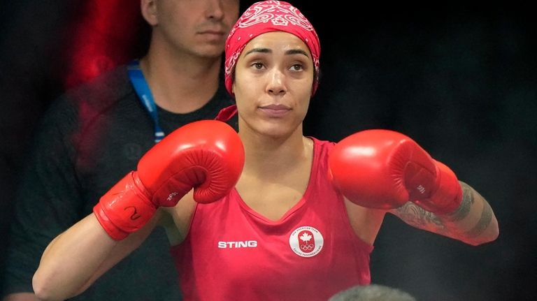 Canadian boxer Tammara Thibeault arrives ringside for her middleweight gold...