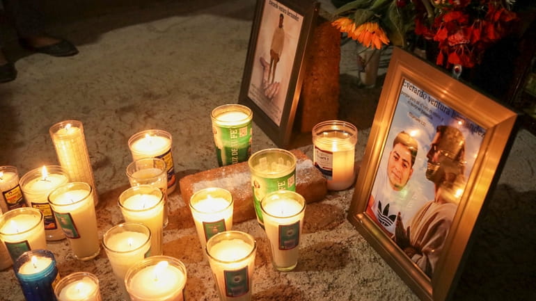 An improvised altar with photos of Evarado Ventura Hernández stands...