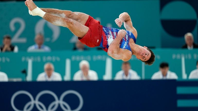 Brody Malone, of United States, competes on the floor exericse...