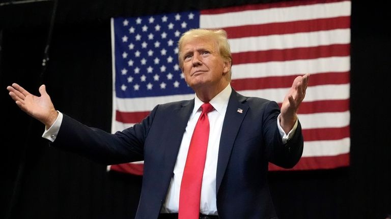 Republican presidential nominee former President Donald Trump arrives to speak...