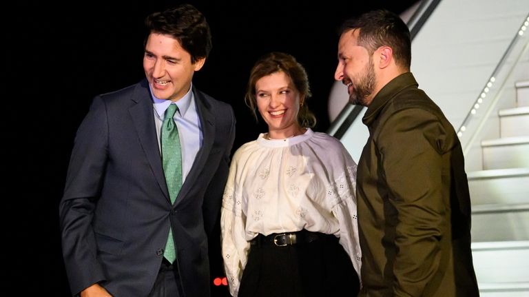 Canadian Prime Minister Justin Trudeau, left, greets Ukrainian President Volodymyr...