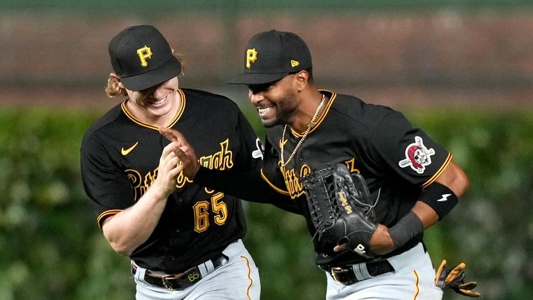 Pittsburgh Pirates right fielder Joshua Palacios, right, and center fielder...