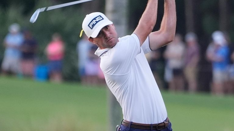 Austin Eckroat hits from the third fairway during the final...