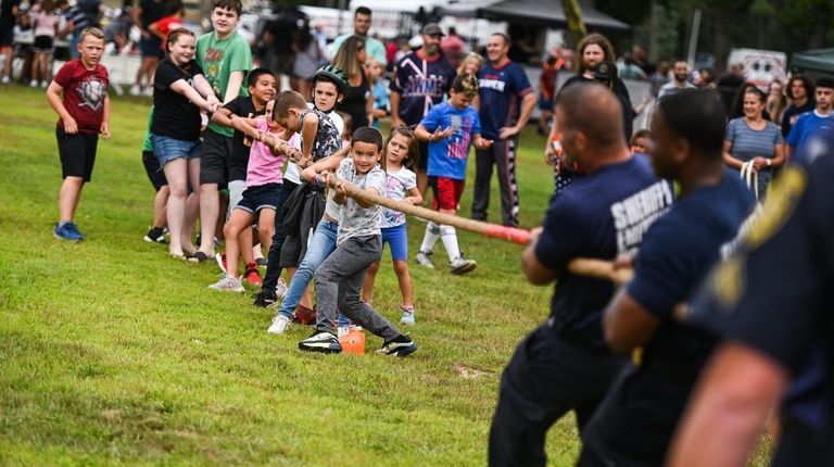 Liam Carrasquilla, 6, of Moriches, leads the pack of children...