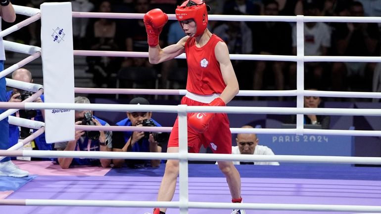 Taiwan's Lin Yu-ting motions between rounds against Bulgaria's Svetlana Staneva...