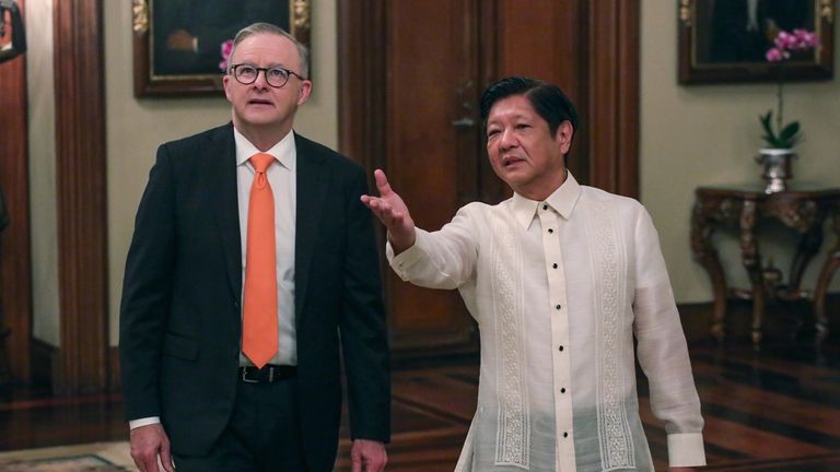 Australia's Prime Minister Anthony Albanese, left, walks beside Philippine President...