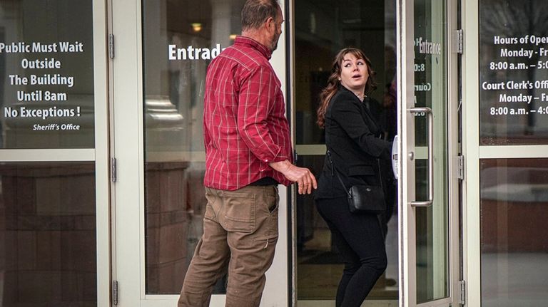 Hannah Gutierrez-Reed, right, arrives at the First Judicial District Courthouse...