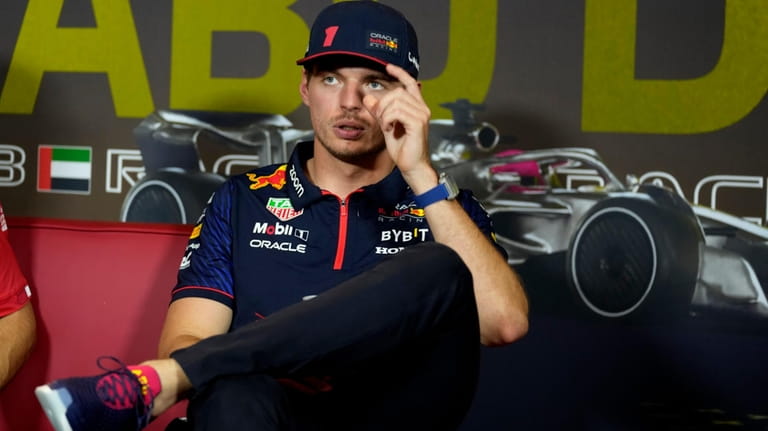 Red Bull driver Max Verstappen, of the Netherlands reacts during...