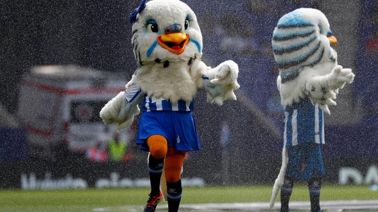 Perica, the mascot of Español F.C., performs before the match...