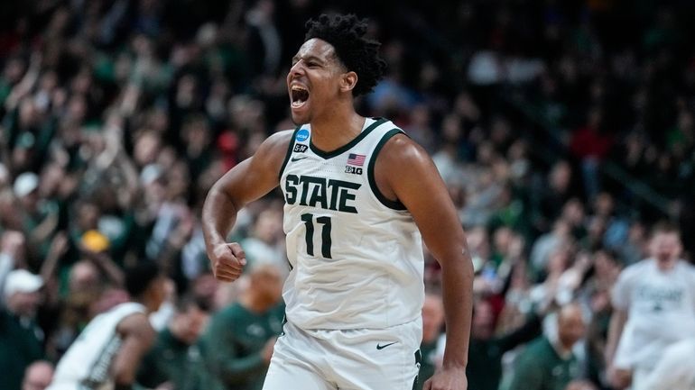 Michigan State guard A.J. Hoggard (11) celebrates in the second...