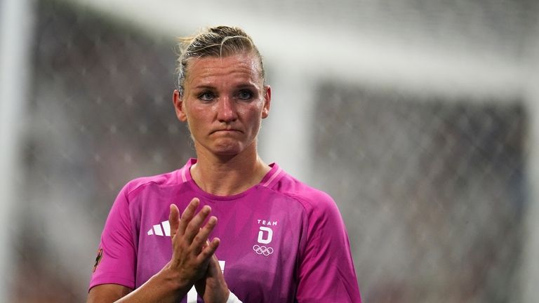 Germany's Alexandra Popp applauds as she walks off the pitch...